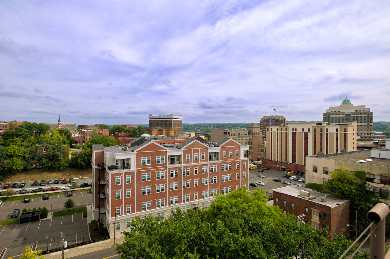 the view of the city from the top of a building